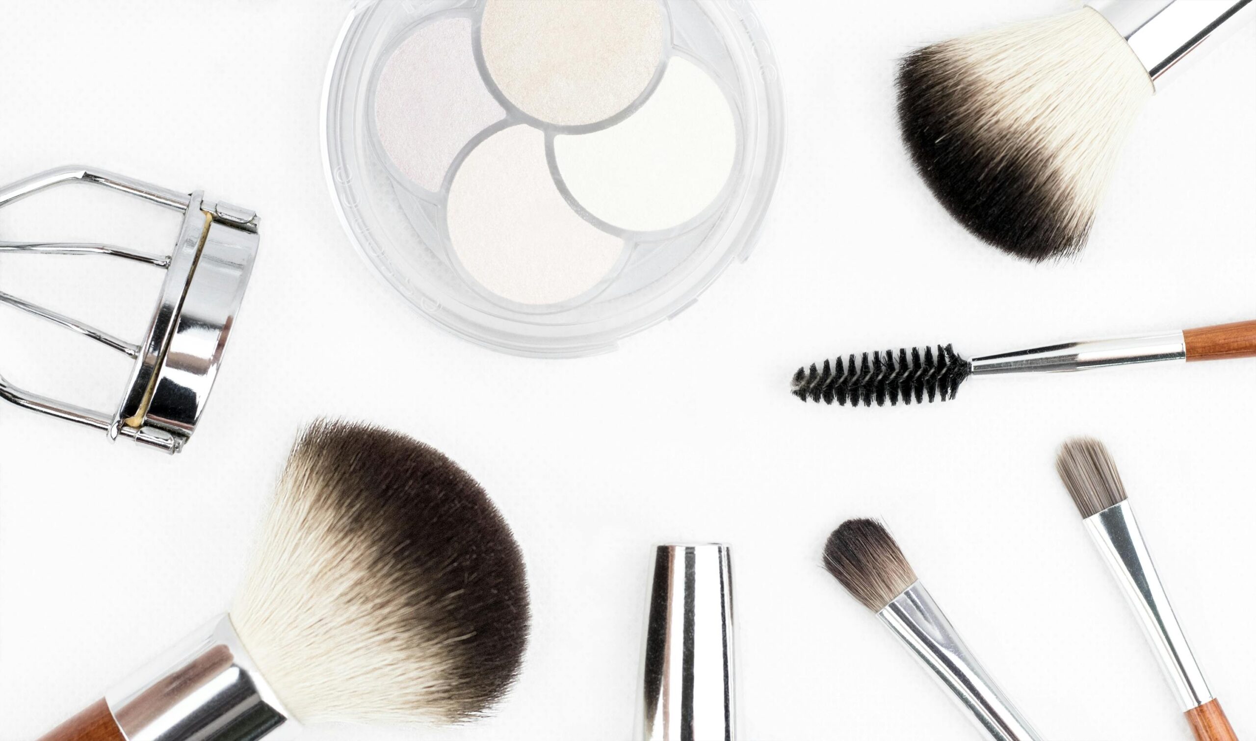 Close-up image demonstrating layered application of liquid foundation, concealer, and setting powder