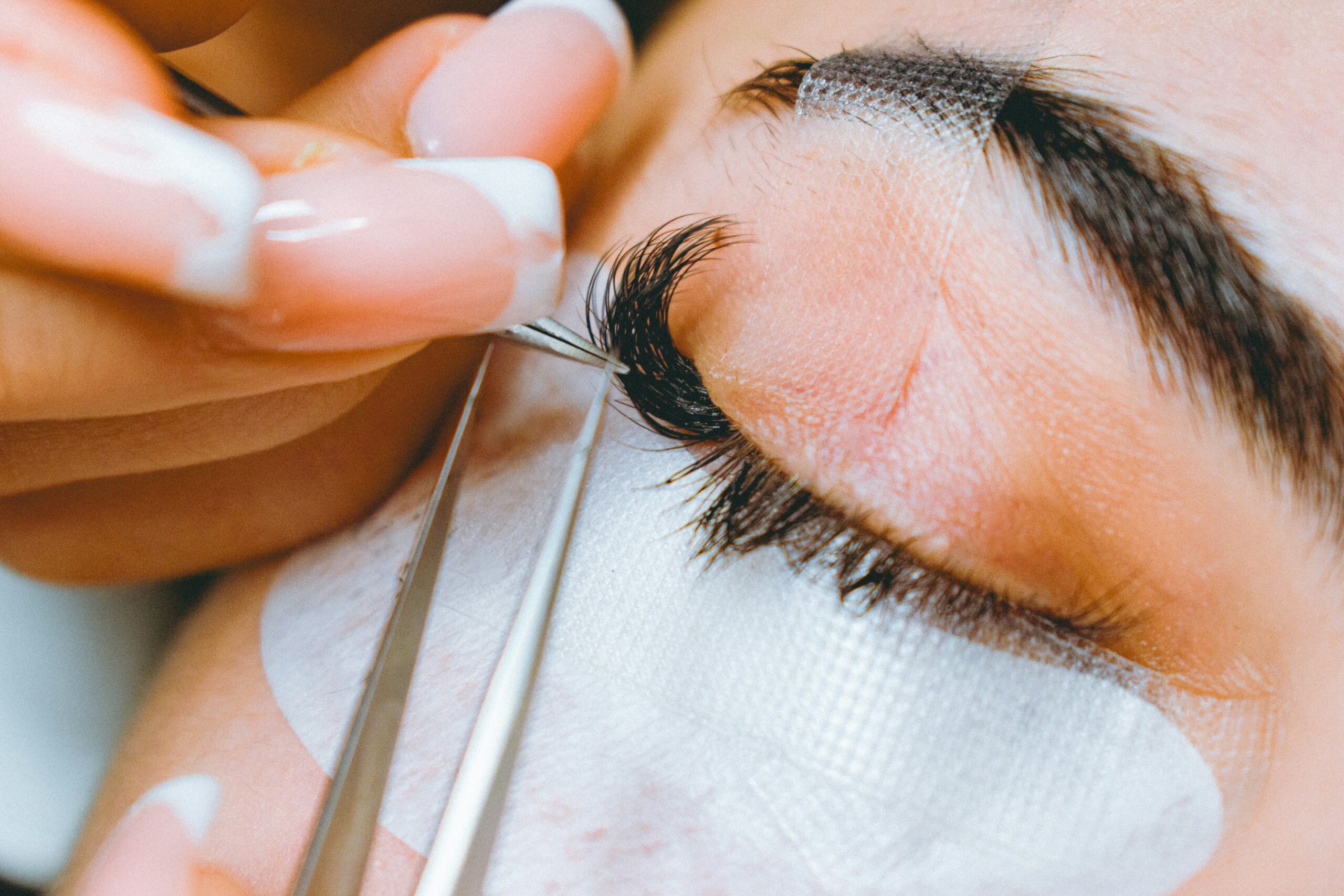 Close-up shot showing how to apply eye primer before smudge-proof eyeliner usage