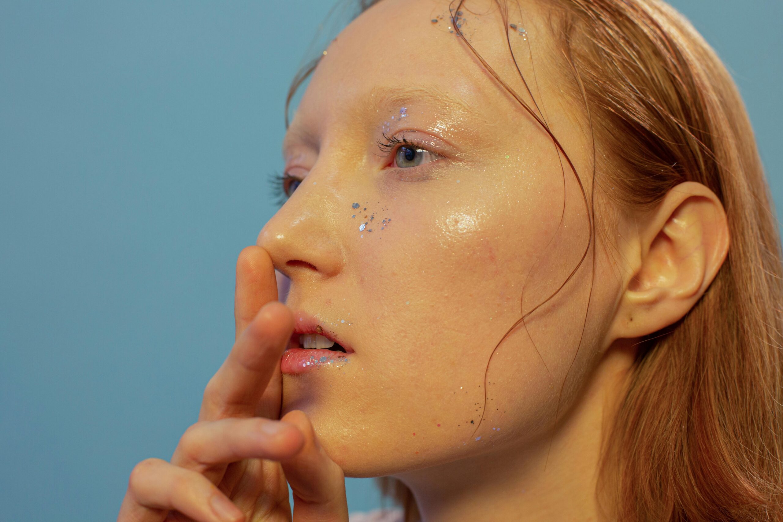 Glowing woman showcasing perfect waterproof makeup technique