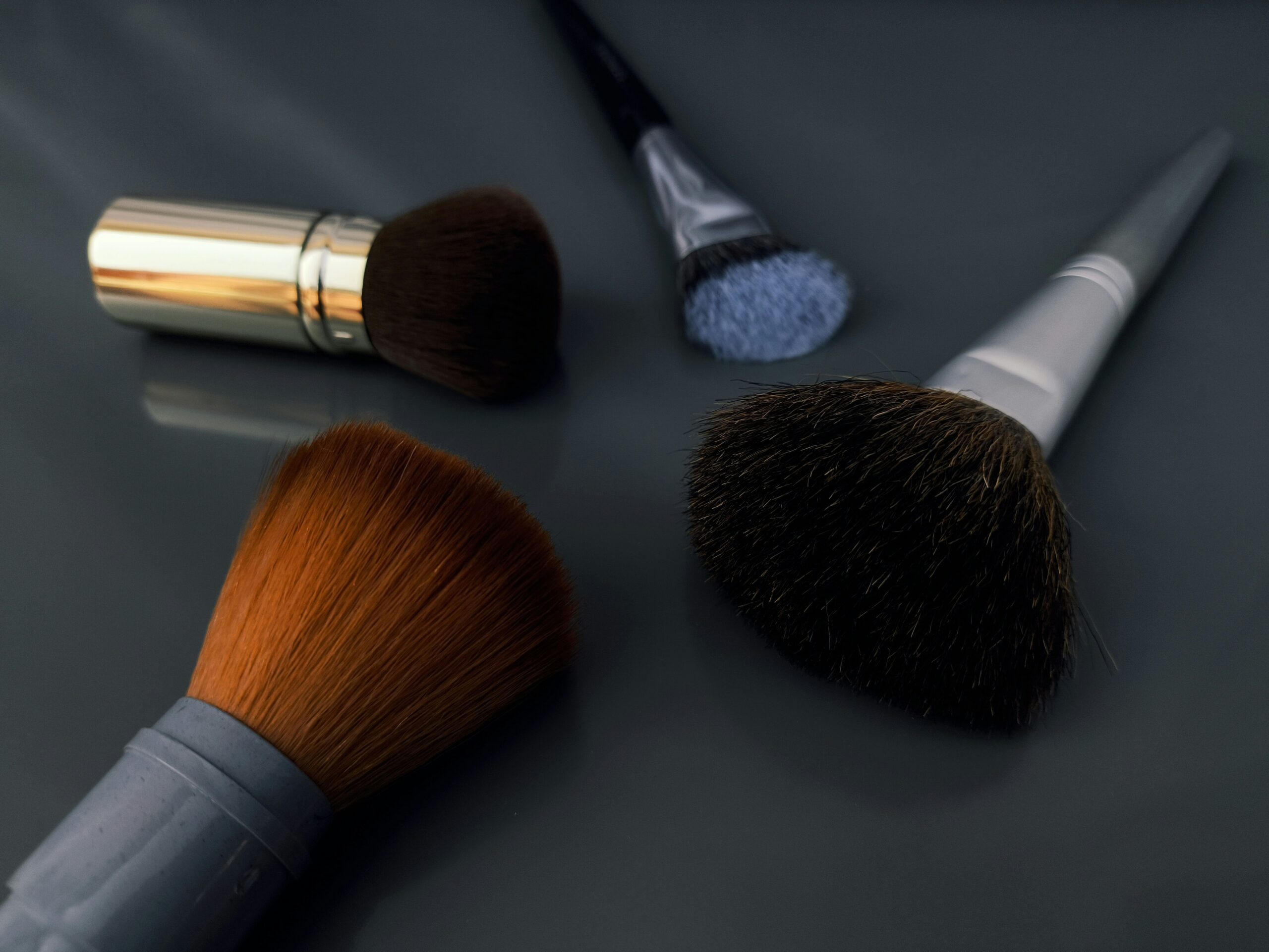 Infographic explaining the science of waterproof makeup with text 'Waxes, Oils, Silicone = Long-Lasting Formula'