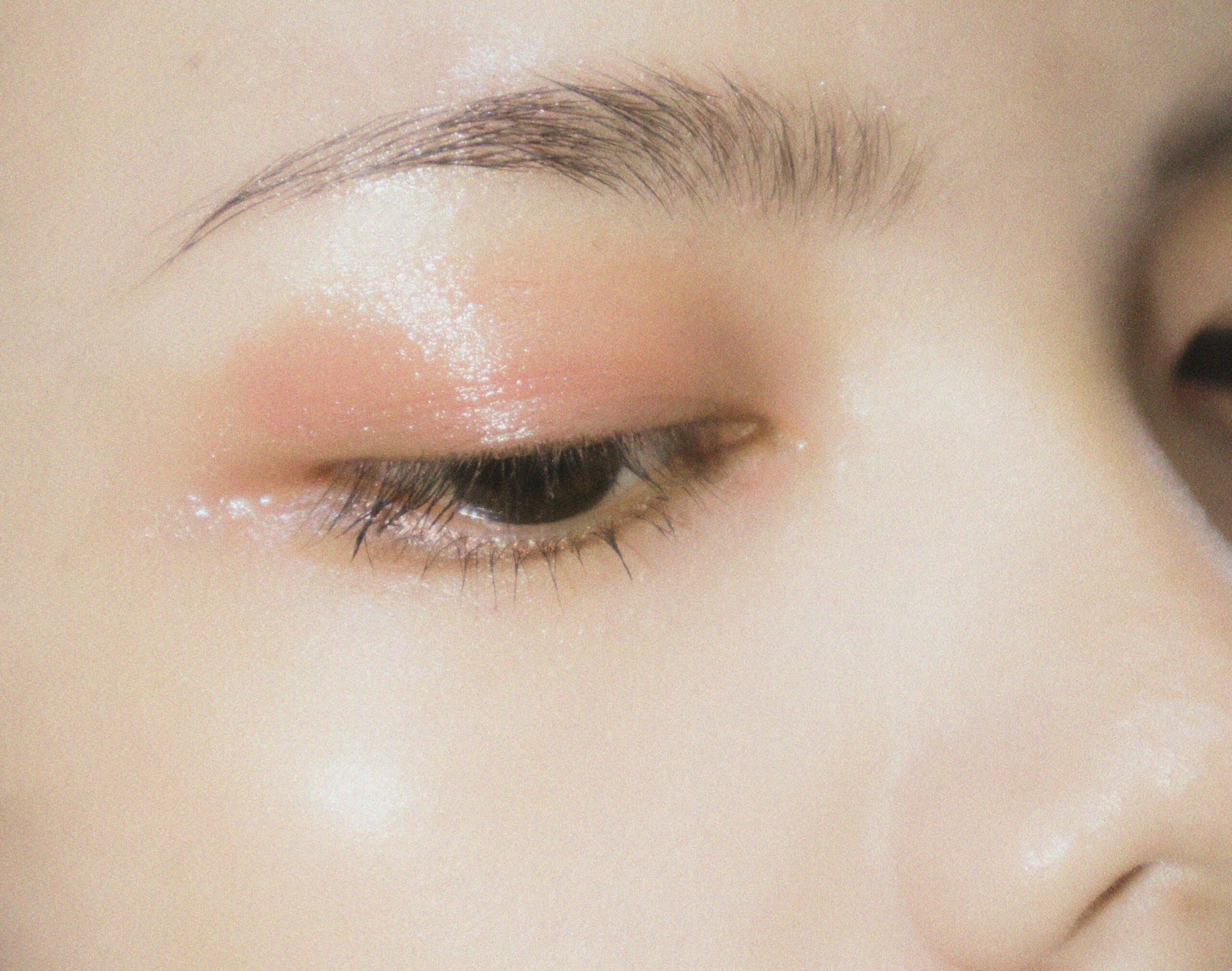 Before and after photo showing the impact of resistant liquid liner on a woman's eye makeup