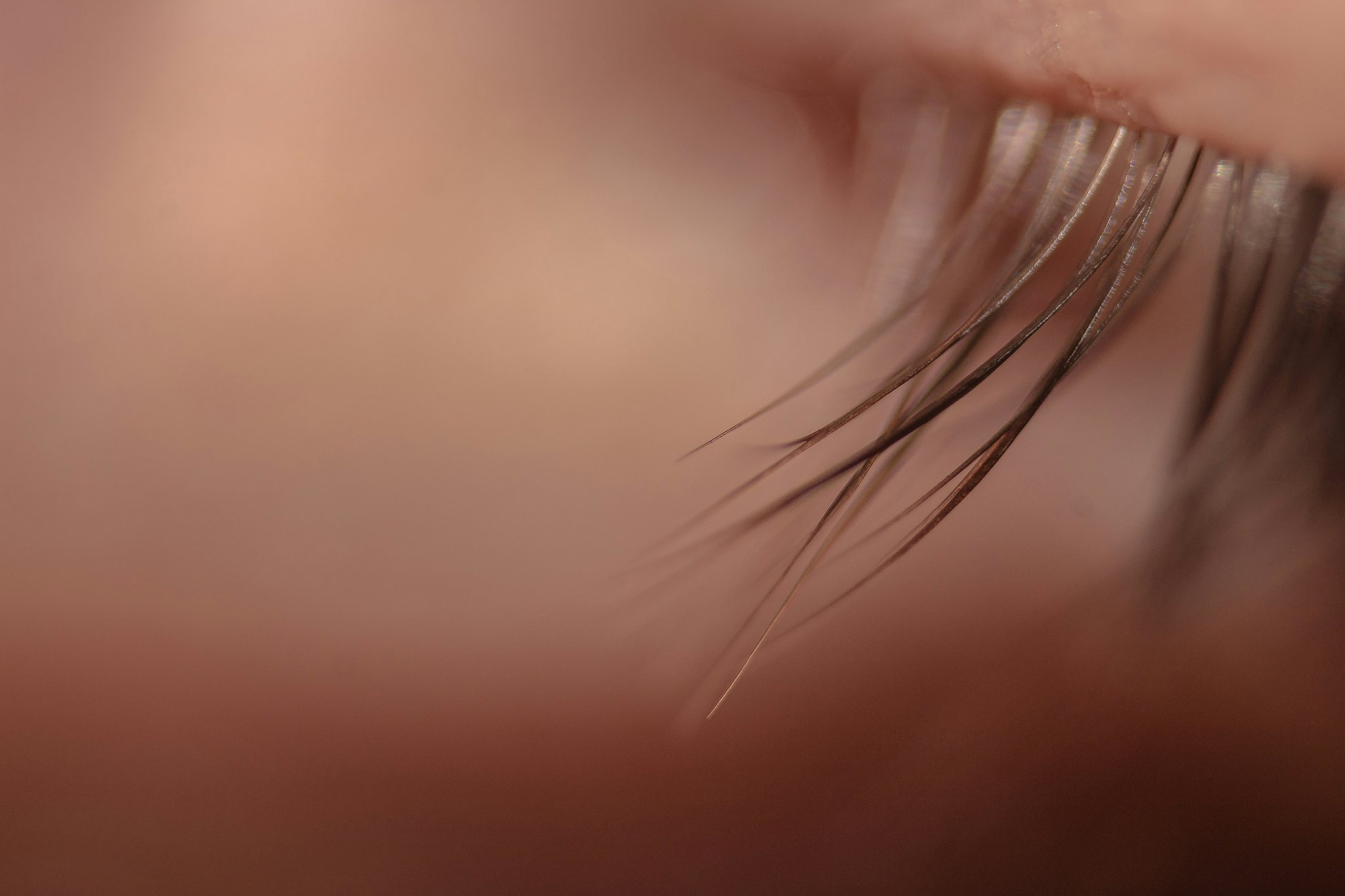 Close-up photo showing smeared black eyeliner under eyes