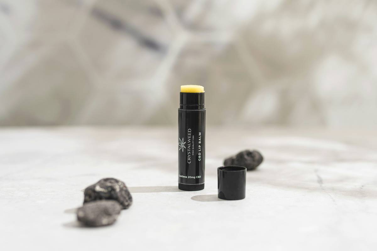 A beauty influencer demonstrating lasting lip color during a workout session.