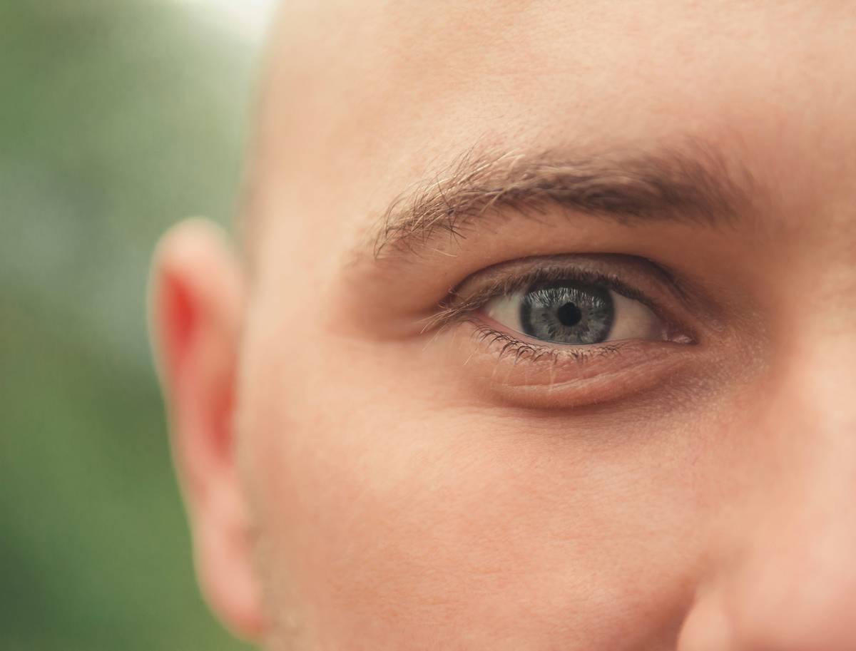 Woman touching her faded eyebrows in disappointment