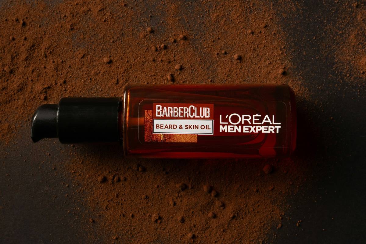 A woman wiping off melted makeup after sweating outdoors