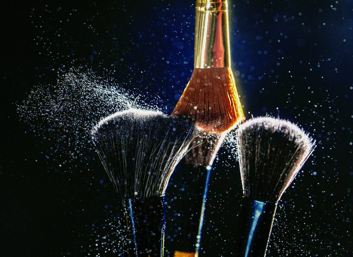 Comparison chart showing waterproof vs water-resistant makeup ingredients and wear time in humid conditions